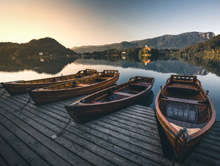 boats at lake bled slovenia during summer sunset