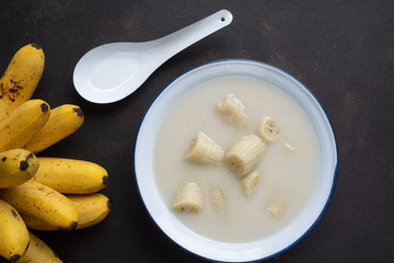 Thai dessert : Kluay Buad-Chi , Banana in coconut milk.Traditional dessert of asian, Thailand.Selective focus.