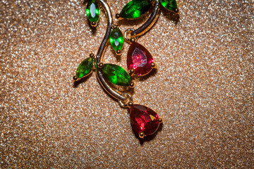 Earrings with red and green zircons