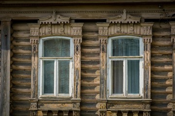 House with carved wooden windows