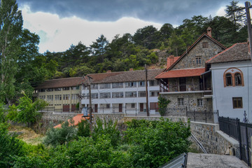 Fototapeta na wymiar Buildings on the territory of the Trooditissa Monastery - the male monastery of the Paphos Metropolis of the Cyprus Orthodox Church, located in the Troodos Mountains