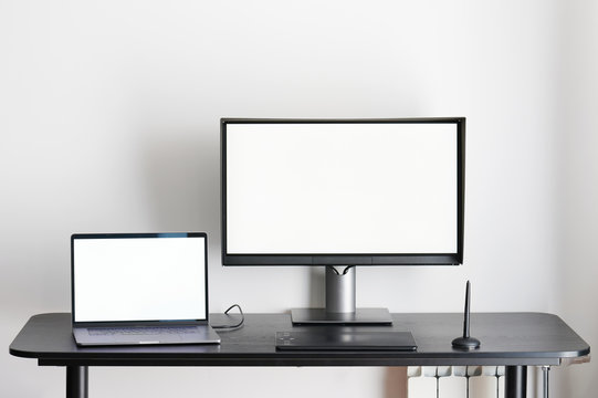 Desk with laptop and computer monitor