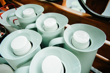 several thermos jugs with lids