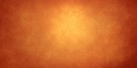 golden abstract shining background with darkening at the edges and glitter from the light in the center. Bright festive background for decoration and banners