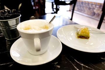 a cup of freshly made cappuccino in a cafe
