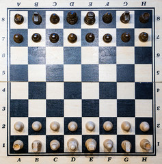 black and white chessboard with chessmen (game)