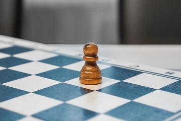 chessman pawn on a chessboard