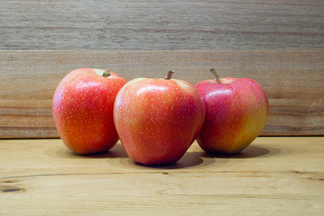 red apples on wooden table