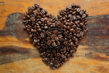 Coffee beans in the cup and coffee beans heart