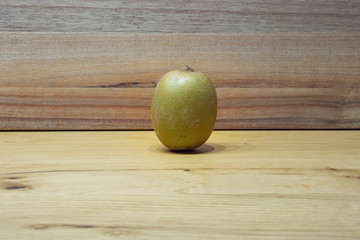 kiwi fruit on a wooden table