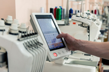 Fabric industry production line. Textile factory. Working tailoring process