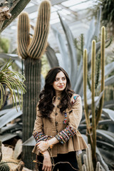 Beautiful attractive woman wearing beige fashion jacket look away