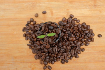 Coffee beans in the cup and leaves