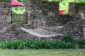 Tye hammock is in the shade.