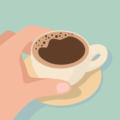 Hand holding a cup of coffee