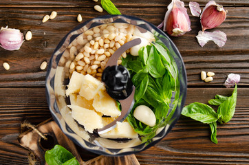 Ingredients for italian national traditional genovese pesto sauce in food processor bowl. Flat lay...