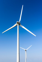 Close-up of windmills group with blue sky, on the west coast of Taiwan.