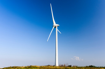 Close-up of windmills group with blue sky, on the west coast of Taiwan.
