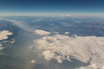 View of the mountain landscape from the plane in the afternoon
