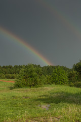 rainbow after a storm, after a severe thunderstorm in the forest