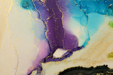 Abstractblue, violet and gold glitter color background. Marble texture. Alcohol ink colors.