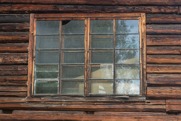 window of an old wooden house dust on the glass