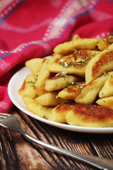 Polish dish kopytka served at the table