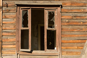 Obraz na płótnie Canvas window of an old wooden house dust on the glass