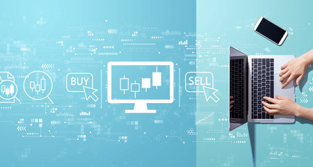 Stock trading theme with person working with a laptop