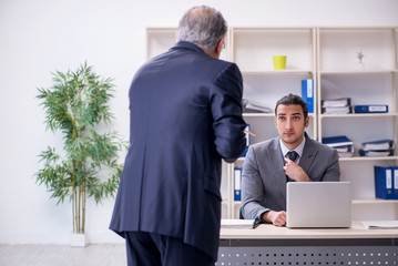 Fototapeta premium Old and young businessmen in business meeting concept
