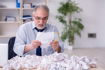 Businessman rejecting new ideas with lots of papers