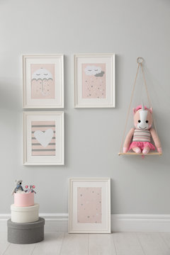 Children's room interior with toys and cute pictures on wall