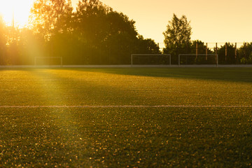An empty soccer field in the sun © Evgenia Terekhova