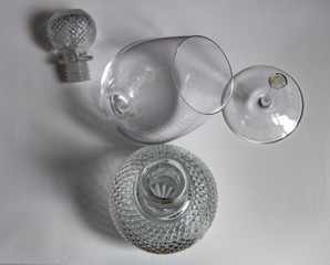 still life with a beautiful glass decanter and fruits on a dark background