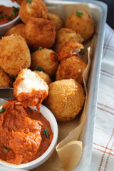 Cheese balls with tomato sauce. Fried snack starter meal. Party food