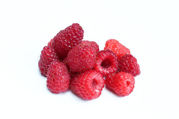 Portion of red juicy raspberries isolated on white background. Organic summer fruit