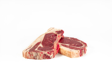 Matured veal loin entrecôte, two fillets , photograph taken on pure white background, for e-commerce. front view