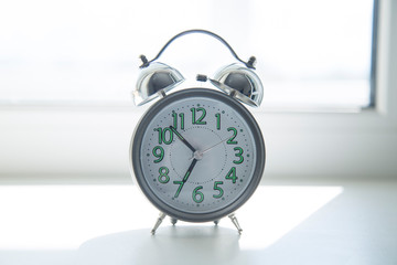Alarm clock on a white background. Concept. Place for the label.