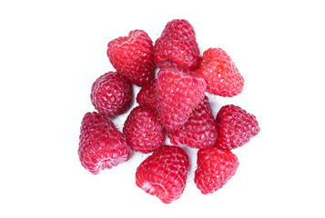 Portion of red juicy raspberries isolated on white background. Organic summer fruit