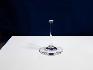 still life with broken glass goblet on dark background