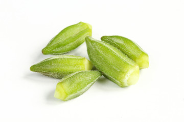 Group of isolated okra seeds isolated on white background. Fresh raw vegetable