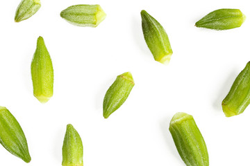 Flat lay texture made of green okra vegetables isolated on white background - obrazy, fototapety, plakaty
