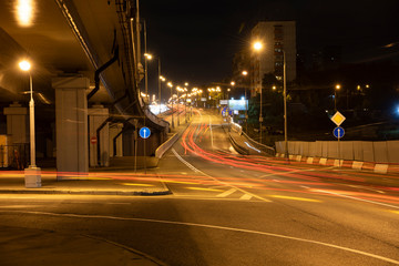 Fototapeta premium night lights of fast moving cars on the freeway at night