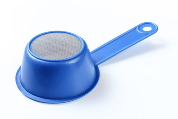 Blue sieve isolated on white background. Kitchenware with net. Strainer