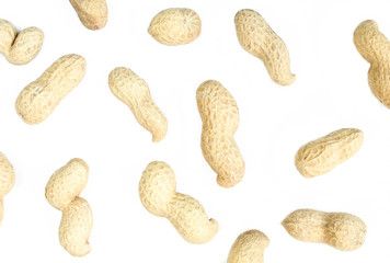 Wallpaper/texture made of peanuts in shell isolated on white background. Flat lay