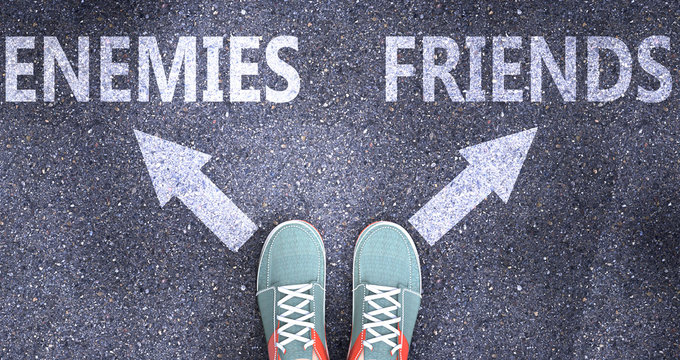 Enemies and friends as different choices in life - pictured as words Enemies, friends on a road to symbolize making decision and picking either Enemies or friends as an option, 3d illustration