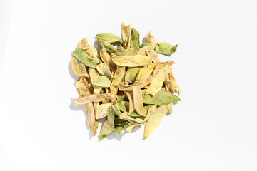 Pile of dried string beans isolated on white background. Colorful meal ingredient