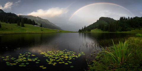 Rainbow in the Swiss alps I Pano