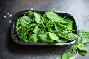 spinach green juicy leaves organic salad serving portion size natural product top view place for...