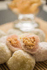 Traditional dessert, sticky sweets known as mochi with crush peanut filling inside 